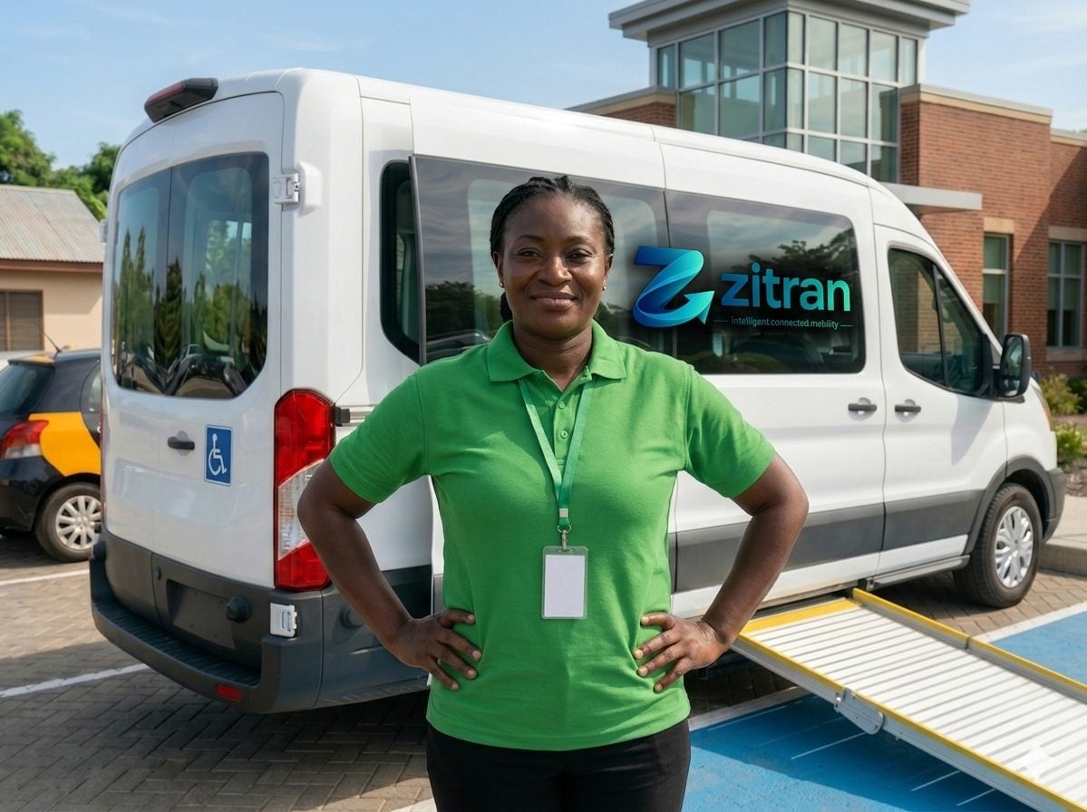 A confident female Zitran Captain standing in front of a Zitran Access vehicle, ready to drive