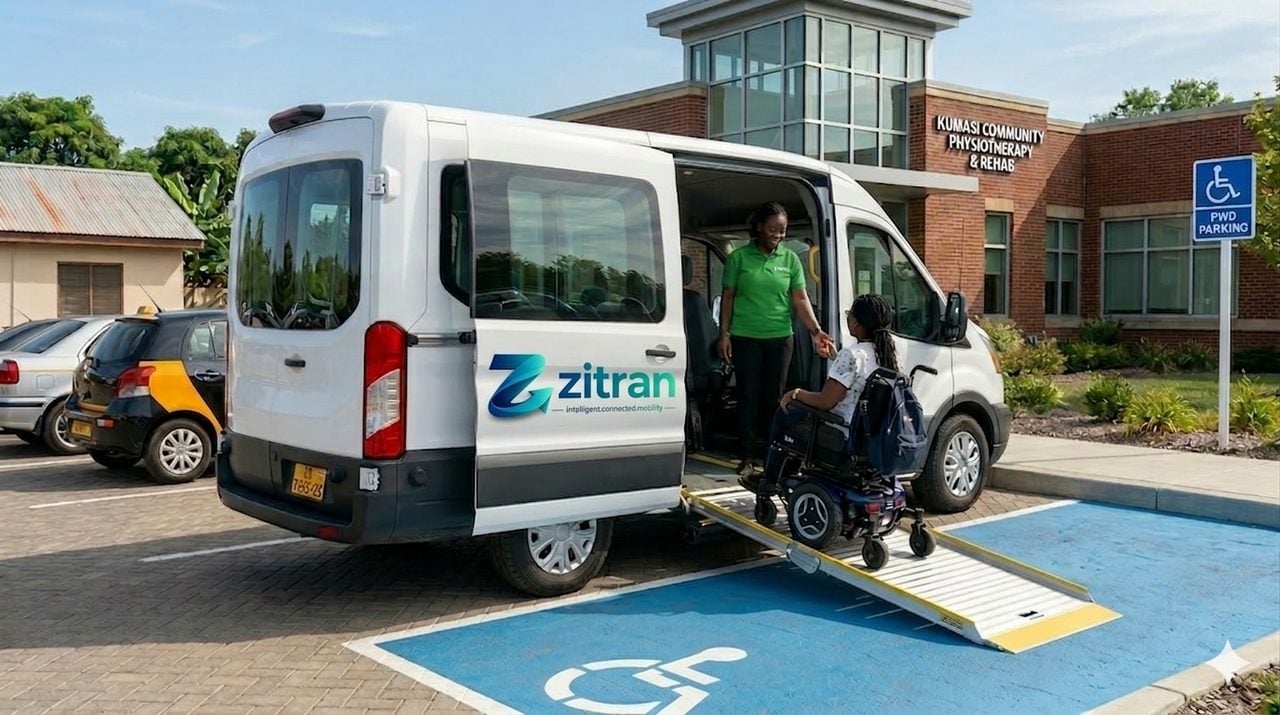 Zitran Access wheelchair-accessible van with ramp deployed, an Access Captain assisting a rider in a wheelchair